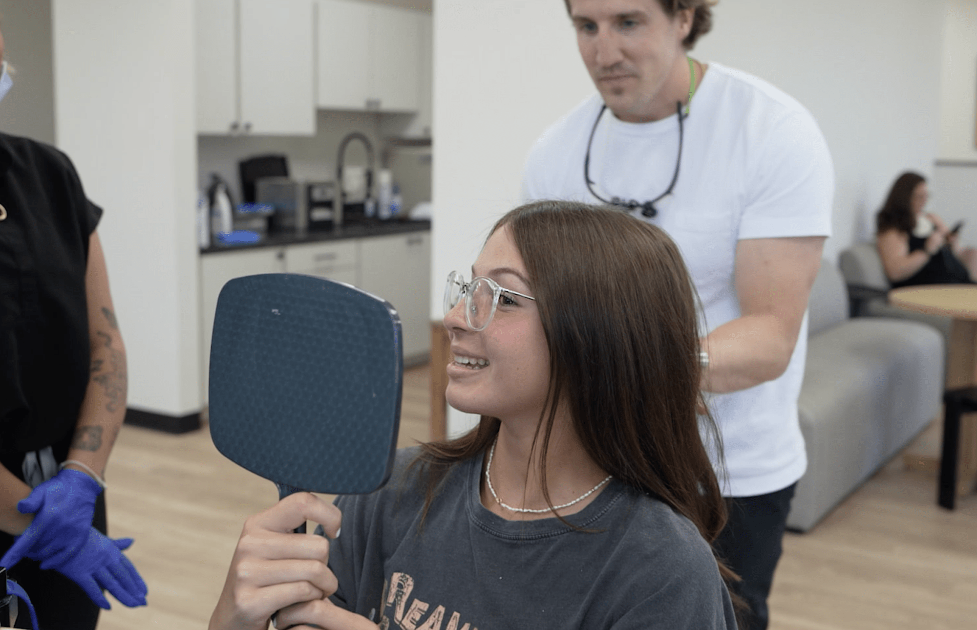 orthodontic patient smiling with braces