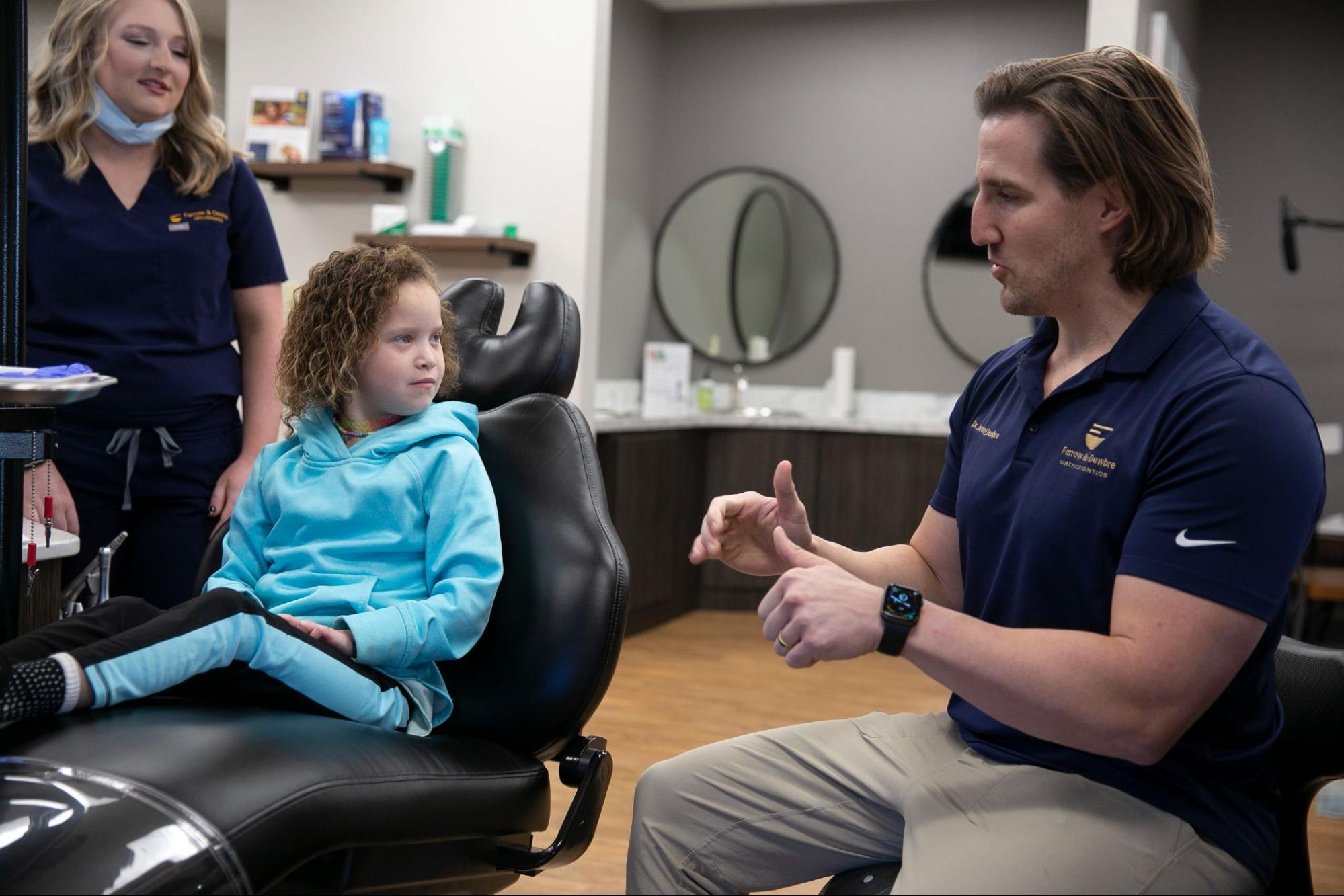 child patient and team members smiling